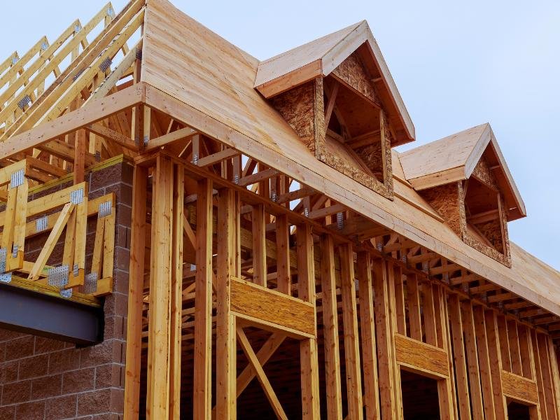 Wooden framing structure of a house under construction.