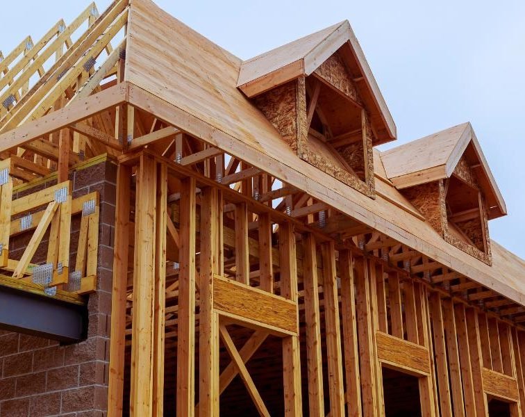 Wooden framing structure of a house under construction.